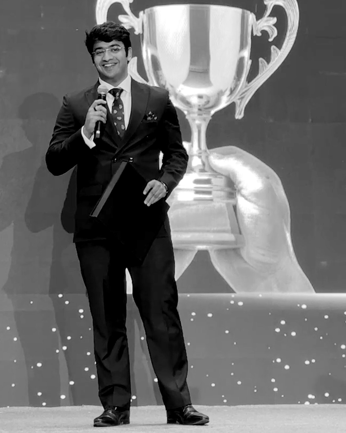 Prashant Sharma speaking on stage at an awards ceremony